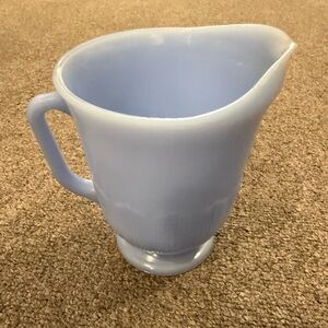 vintage Pyrex Delphite blue milk pitcher in the "Pie Crust" pattern.